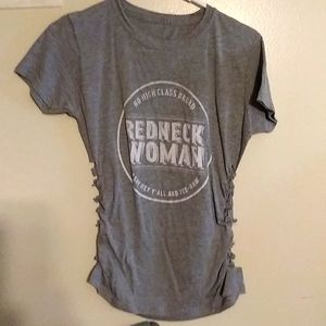 A redneck women shirt with braided sides, not ripped. Never worn.